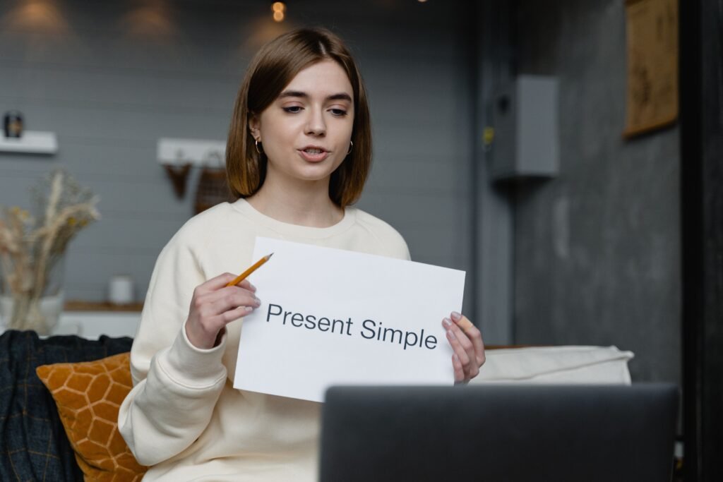 Online English tutor teaching the present simple tense